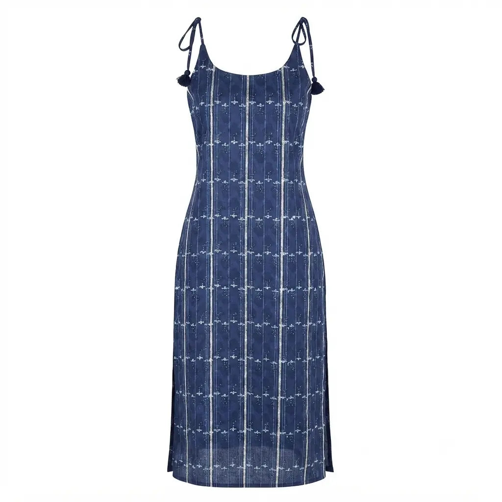A sleeveless blue midi dress with thin shoulder ties, featuring a white vertical stripe pattern and a subtle grid design, shown against a plain white background.