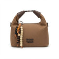 A brown canvas shoulder bag with dark brown leather handle accents and a decorative beaded charm, featuring the debossed brand name 'coin '20N' on the front, set against a plain white background.