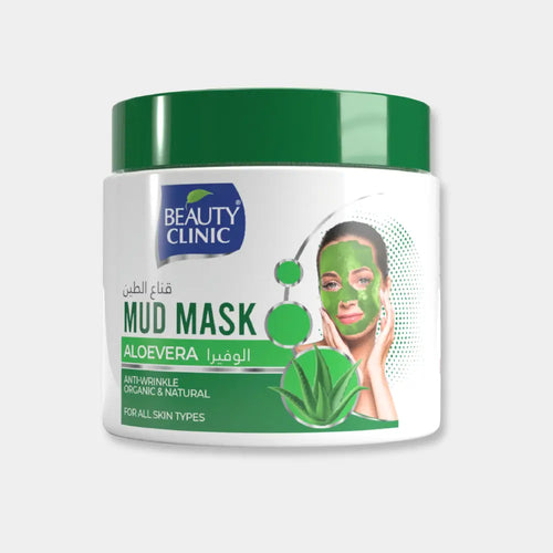Beauty Clinic Mud Mask in a 500ml white plastic jar with a green lid. The label features a green leaf motif, Arabic text, and an illustration of a woman wearing a green face mask.